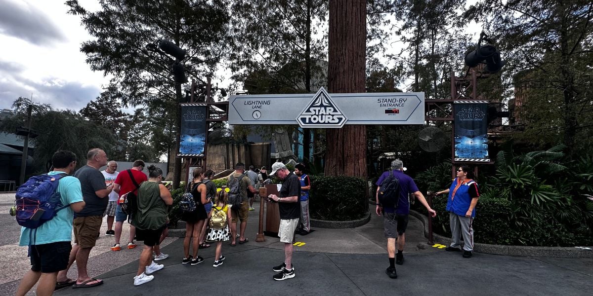 Guests waiting in line at the Star Tours entrance in Star Wars: Galaxy’s Edge at Disney’s Hollywood Studios.