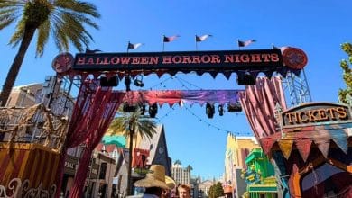 Halloween Horror Nights entrance at Universal Studios Florida illuminated at night.