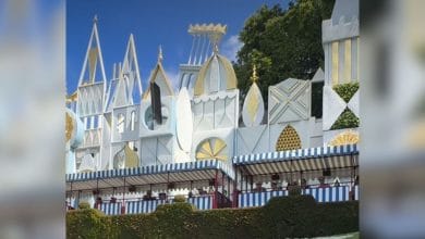 A phone mid-air falling from above "it's a small world" at Disneyland.