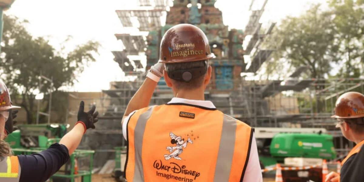 Disney Imagineers in front of indiana jones ride construction at animal kingdom